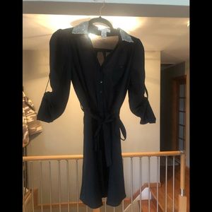 Black dress with tie belt with a bit of flare on the collar!